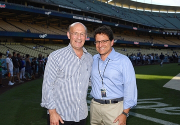 Stan Kasten and Mark Attanasio stand in Dodger Stadium.