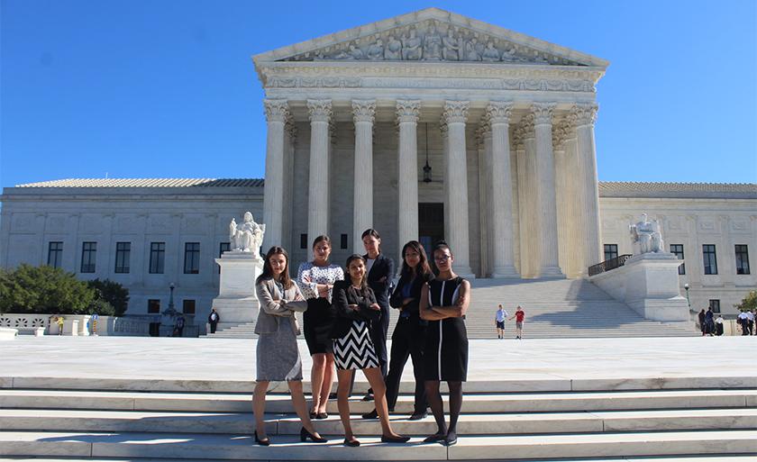 The Health Justice Advocacy Clinic students stand in front of the U.S. Supreme Court building..