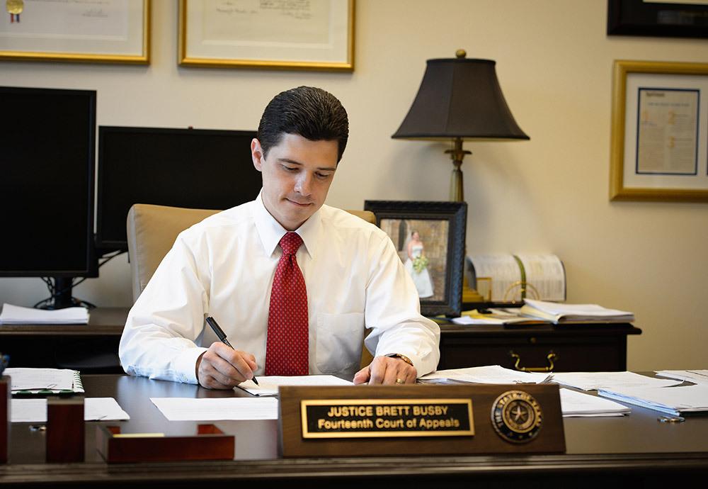 Busby at his desk at the Fourteenth Circuit Court of Appeals