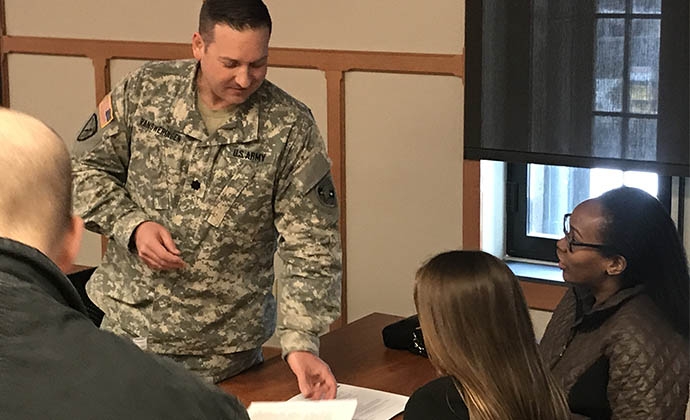 Lieutenant Colonel Scott Thomas Vansweringen ’16 LL.M, with Courtney Murray '20 (far right)